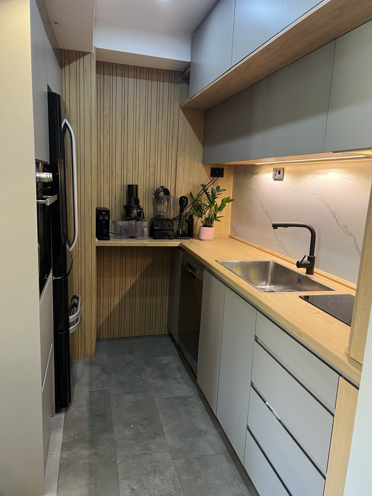 Modern bathroom at Apex Apartments with walk-in shower and toiletries