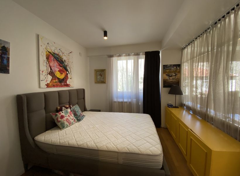Dining area at Apex Apartments with modern furniture and lighting