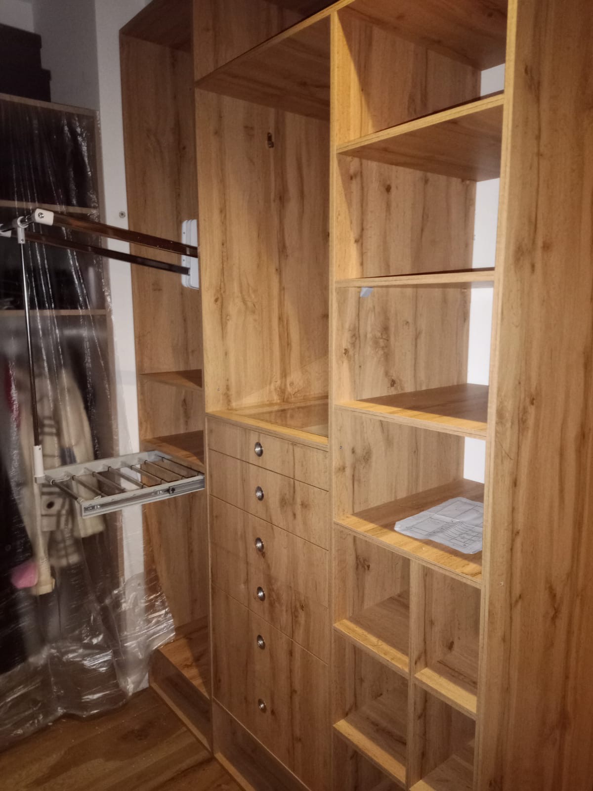 Spacious walk-in closet at Apex Apartments with ample storage space